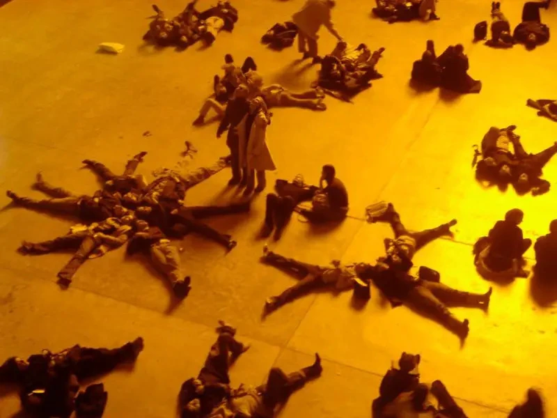 Thoughts On: The Weather Project By Olafur Eliasson 2 People Shadows Orange Light