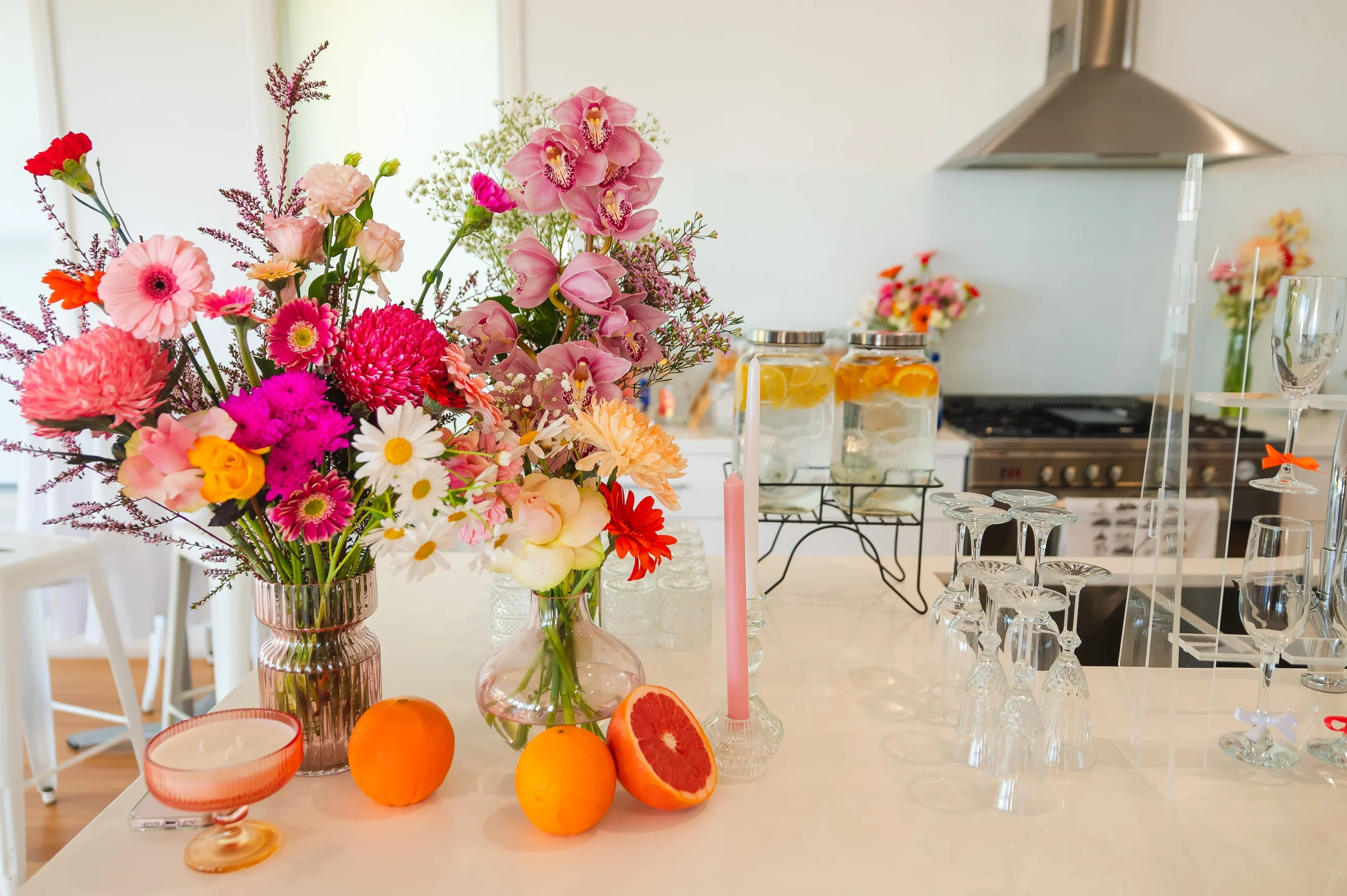 Life’s Milestones: When To Hire A Photographer And Why These Moments Matter 1 Kitchen With Floral Vases, Oranges, Grapefruit, Citrus Water Jars, Upsidedown Glasses, Stovetop.