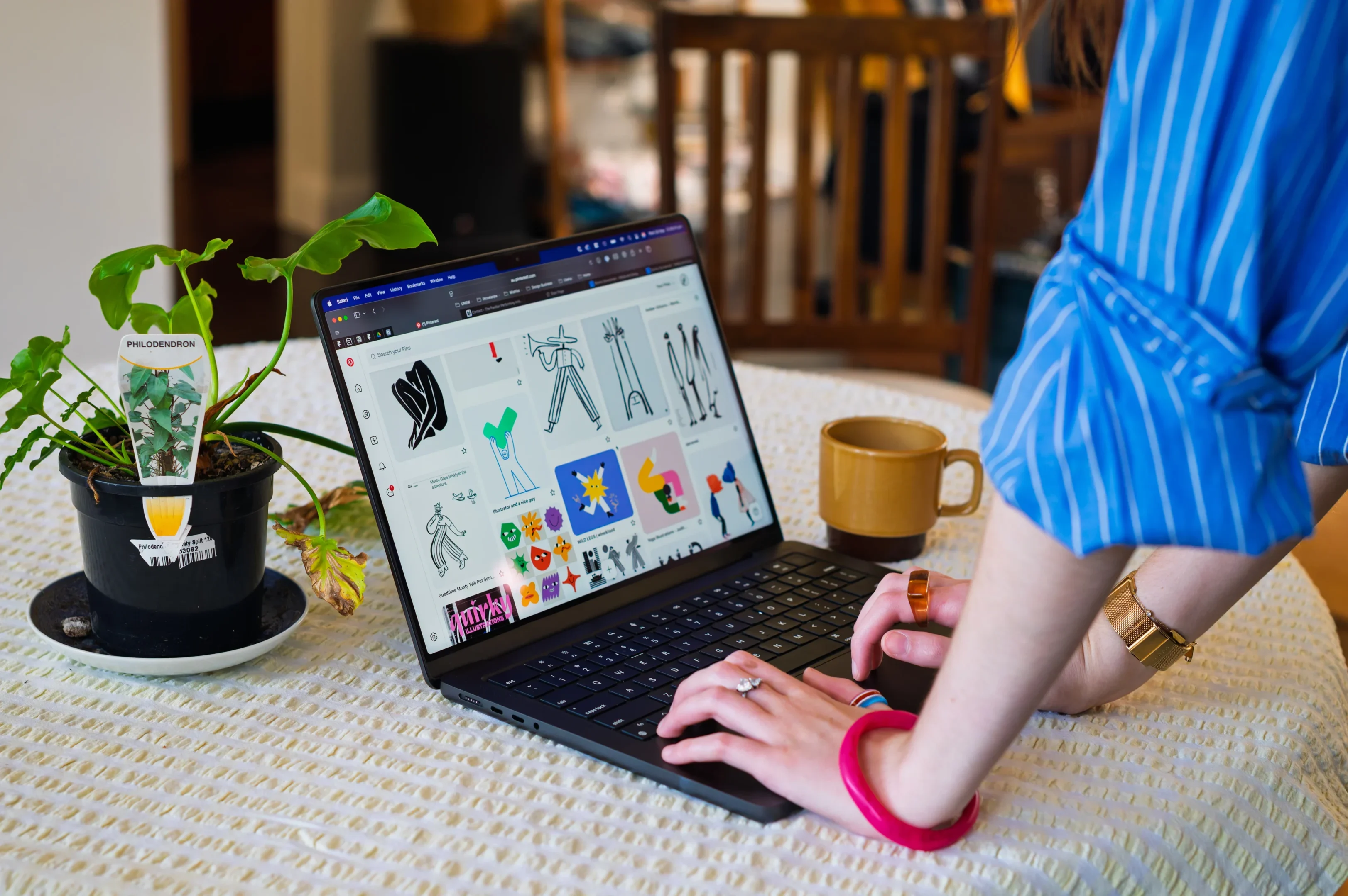 Hiring The Right Lens: Green And Red Flags To Find Your Ideal Photographer Match 4 Person Wearing Blue Striped Shirt Using Laptop On A Table With A Philodendron Plant And Brown Mug